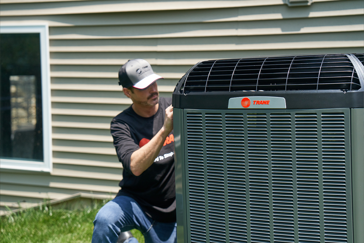 Trane talent installing AC unit