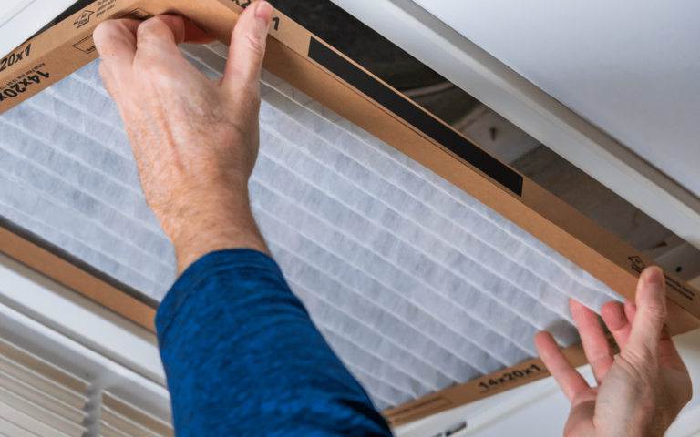 Technician installing air filter