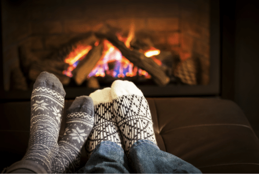 Socks next to a fireplace